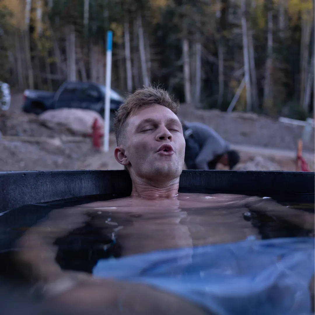 A member in the cold plunge at a DBF event